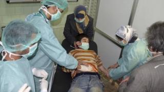A boy, affected in what the government said was a chemical weapons attack, is treated at a hospital in the Syrian city of Aleppo on Tuesday
