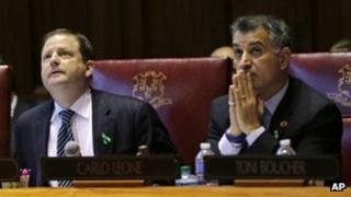 Senate Minority Leader John McKinney, left, and Connecticut Senator Carlo Leone, watch during a vote for an amendment of the gun-control bill on the Senate floor at the Capitol in Hartford, Connecticut on 3 April 2013