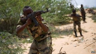 Somali soldiers take part in a training exercise on 28 March 2013 at a camp on the outskirts of Mogadishu, Somalia