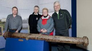Diving club members with cannon