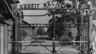 Auschwitz concentration camp entrance with the sign "Arbeit macht frei" over it