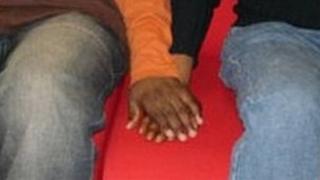 Men holding hands
