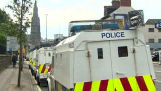 Rows of police Land rovers