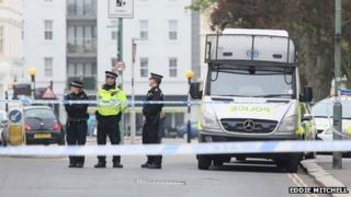 Police officers near the scene of the shooting in Hove