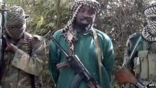 Boko Haram leader Abubakar Shekau flanked by bodyguards (March 2013)