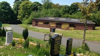 Graffiti on a prayer hall in Pleasington cemetery