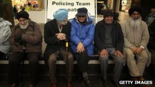 Sikh men sitting in West Bromwich