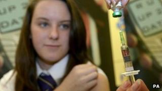 School girl getting jab