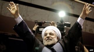 Hassan Rowhani waves to the crowds at a campaign rally in Tehran on 8 June 2013