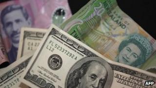 File photo: New Zealand and American currency