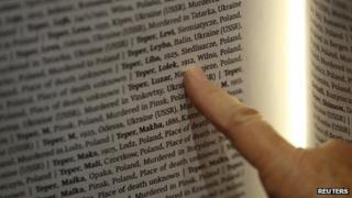 Rachel Barkai from Yad Vashem looks for a name of her relative in The Book of Names which contains 4,2 million names of Jews killed during Holocaust at a Permanent Exhibition SHOAH at the Auschwitz-Birkenau State Museum, Block 27
