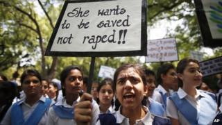 Indian students shout slogans as they hold placards demanding stringent punishment to rapists during a protest in New Delhi, India, Tuesday, April, 23, 2013