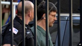 Glendon Scott Crawford, 49, leaves the federal courthouse in shackles after being arraigned in Albany, NY 19 June 2013