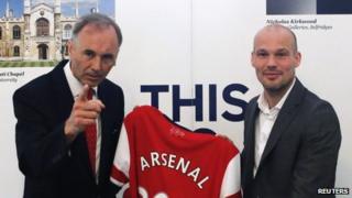 Arsenal club ambassador and former player Freddie Ljungberg (right) and British ambassador to Japan Tim Hitchens pose with a jersey as Ljungberg promotes Arsenal's Asia tour at the British Embassy in Tokyo on 7 June 2013