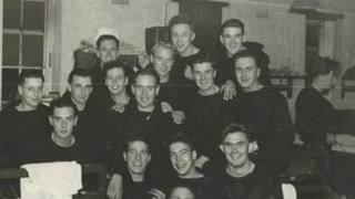 Phillip Mallorie (top row, far right) and Frank Walton (second from the right on row in front of Phillip)