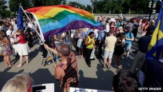 People celebrate outside the Supreme Court after two historic gay marriage rulings in Washington DC 26 June 2013