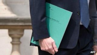 The chancellor carries the Spending Review documents