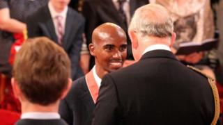 Mo Farah being awarded an CBE from the Prince of Wales