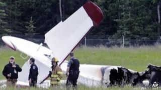 Police and emergency crews stand near the plane wreckage at Soldotna airport. Photo: 7 July 2013