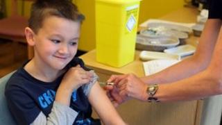 Boy getting his MMR jab