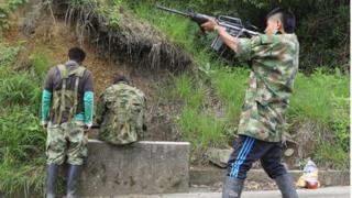 Farc member fires gun (4 June 2013)