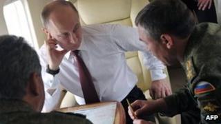 Russian President Vladimir Putin talks with Army Chief-of-Staff Sergei Gerasimov