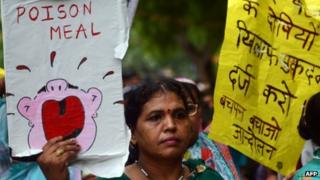 Indian children and activists shout anti-government slogans as they march to parliament in New Delhi demonstrating against the deaths of 23 children in Bihar state after they ate poisoned food, 20 July 2013