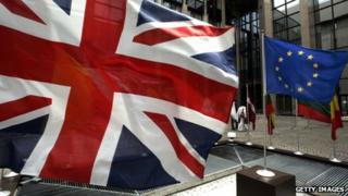 The Union Jack and the flag of the European Union fly side by side in EU's headquarters in Brussels