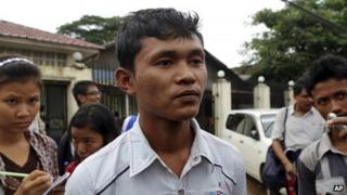 Chit Thura Ko Ko, a Myanmar political prisoner who was released from Insein Prison after receiving amnesty from Myanmar's President Thein Sein, talks to journalists outside the entrance of the prison Tuesday, July 23, 2013, in Yangon, Myanmar.