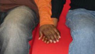 Men holding hands