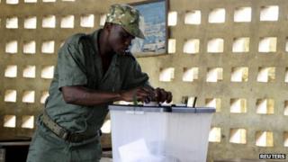 A Togo soldier casts his vote in an early ballot ahead of the country's parliamentary elections