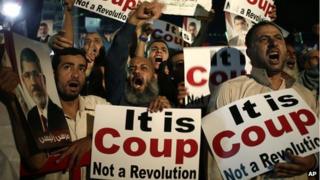Supporters of Egypt's ousted President Mohammed Morsi chant slogans in Cairo, Egypt, on 28 July 2012