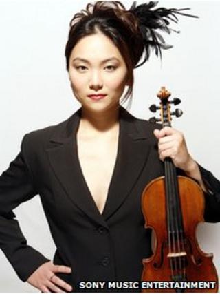 Min-Jin Kym holding the Stradivarius violin that was stolen
