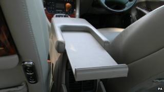 Sliding holder for Queen's handbag