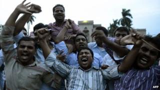 Osmania University students celebrate after the announcement of the separate Indian state of Telangana in Hyderabad on July 30, 2013