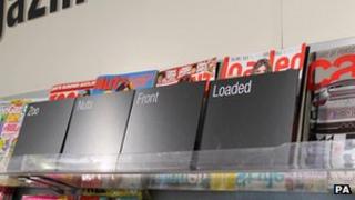 Screens covering lads' magazines in Co-Op store