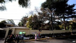 Well-wishers gather outside Nelson Mandela's home on 8 July 2013