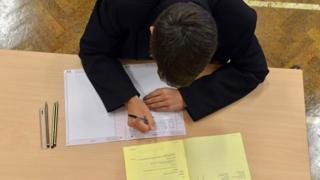 Boy doing exam paper
