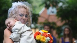 Logan is carried down the aisle by Christine Swidorsky