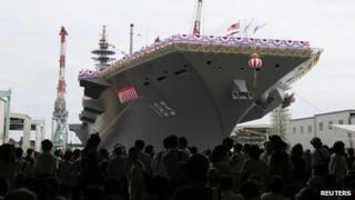 Japan Maritime Self-Defence Force's helicopter destroyer DDH183 Izumo, the largest surface combatant of the Japanese navy, is seen before its launching ceremony in Yokohama, south of Tokyo, 6 August 2013