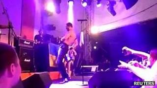 Jared Hasselhoff of Bloodhound Gang urinating on Ukrainian flag at concert in Kiev, 30 July, 2013