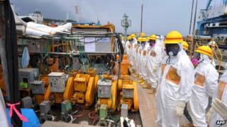 Local government officials and nuclear experts inspect a facility to prevent seeping of contamination water into the sea at Tokyo Electric Power's Fukushima Dai-ichi nuclear plant in Okuma, Fukushima prefecture. Japan, 6 August 2013