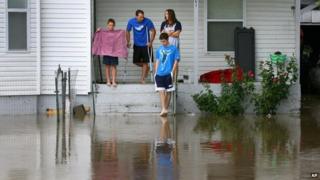 A family declined evacuation orders as a creek overtopped its banks in downtown Newburg, Missouri, on 7 August 2013