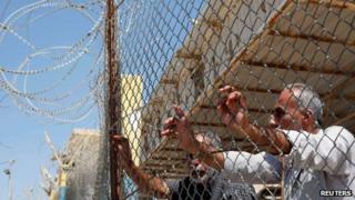 Palestinians at the Rafah crossing between Egypt and Gaza on 19 August 2013