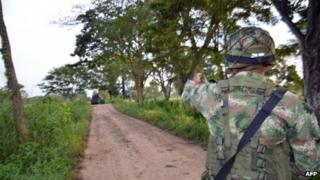 A soldier patrols near the town of Tame in Arauca on 25 August 2013