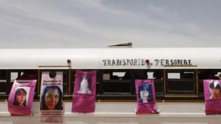 A bus is pasted with posters with pictures of women who went missing, during the burial ceremony of the remains of Brenda Berenice Castillo at San Rafael municipal cemetery, on the outskirts of Ciudad Juarez, 8 June, 2013.