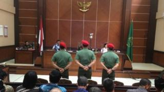Three soldiers were tried in a military court in Jakarta over killing four inmates in a prison attack