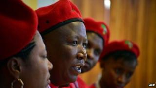 Julius Malema (2nd L) gives a press conference during the launch of his new political party Economic Freedom Fighters (EFF) on July 27, 2013 in Soweto, outside Johannesburg.