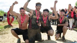 L/Bdr Simpson celebrates with friends after finishing the Spartan Race