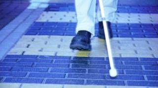 Blind person with cane
